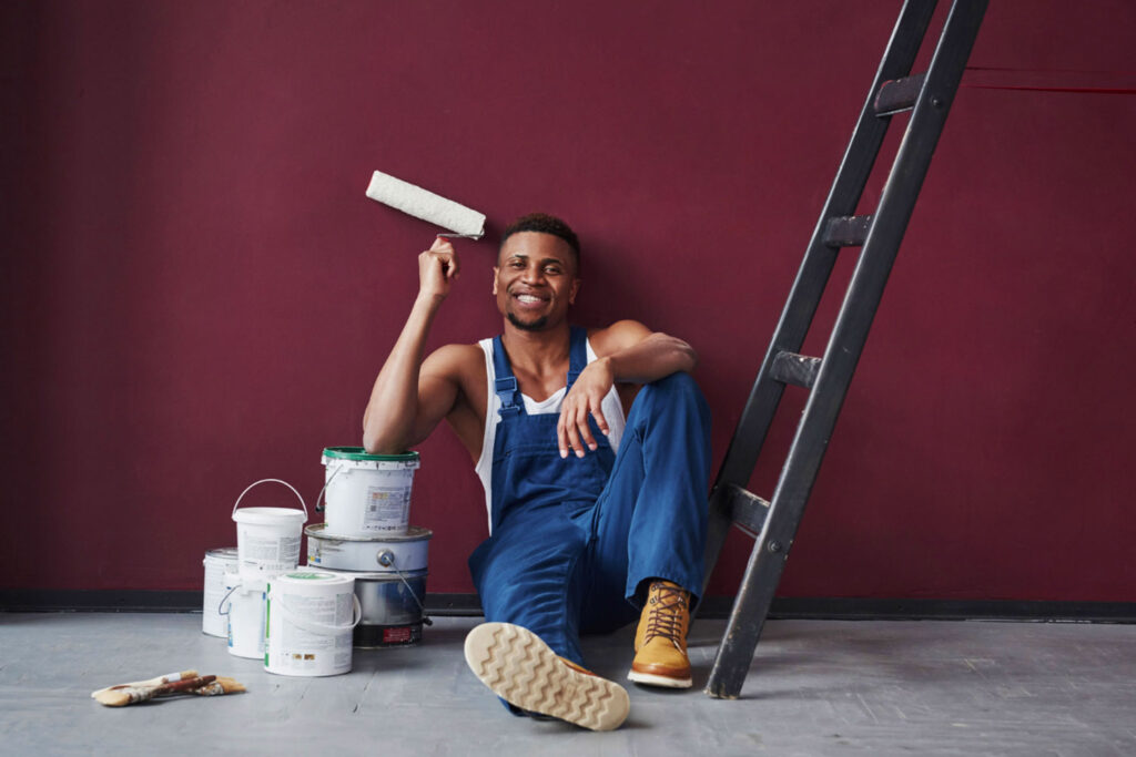A painter working on an interior wall